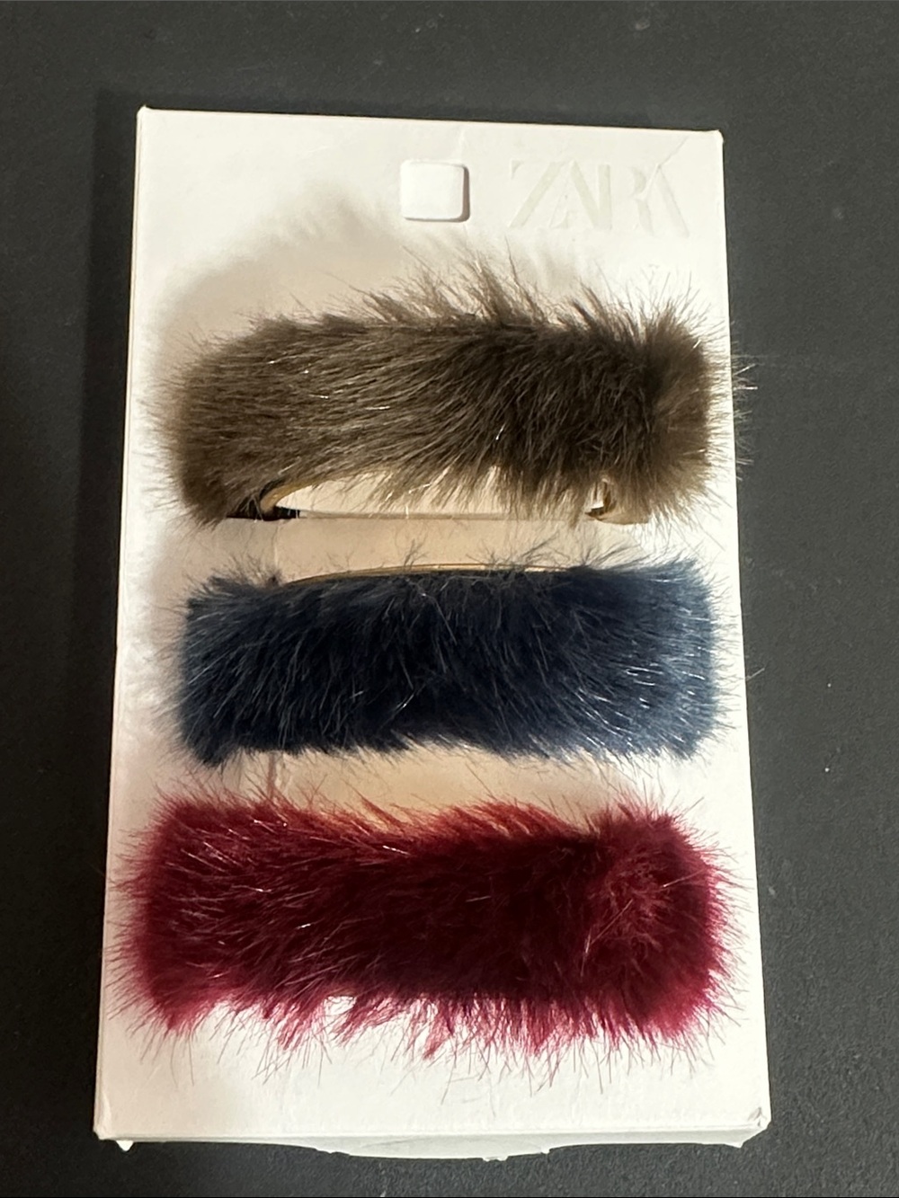 Zara set of 3 faux fur cuff bracelets feature a trio of colors